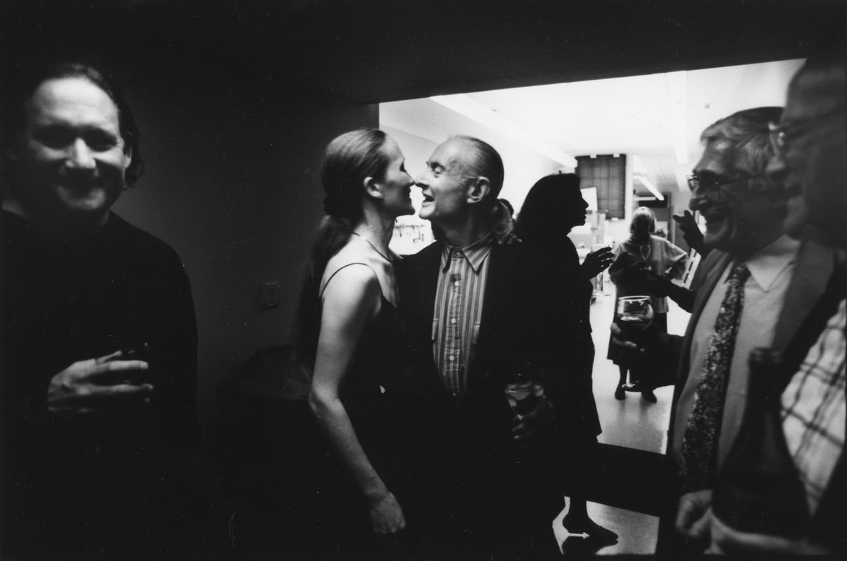 A black and white photo of people at a party