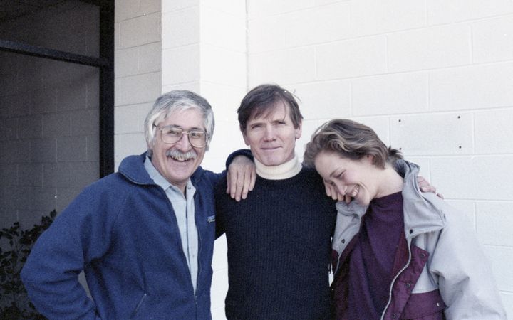 Three people standing together