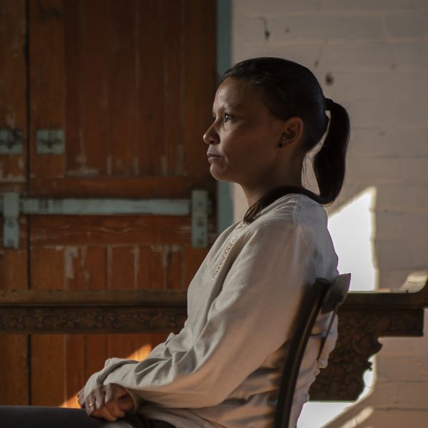 Portrait of a female sitting in a chair