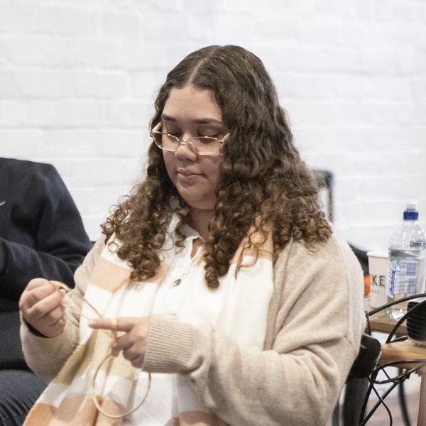 Portrait of a female sitting in a chair