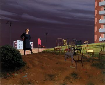 An older woman stands on a hill beside a mismatched collection of chairs in the foreground of the painting. Behind her sections of two apartment buildings rise into a stormy sky.