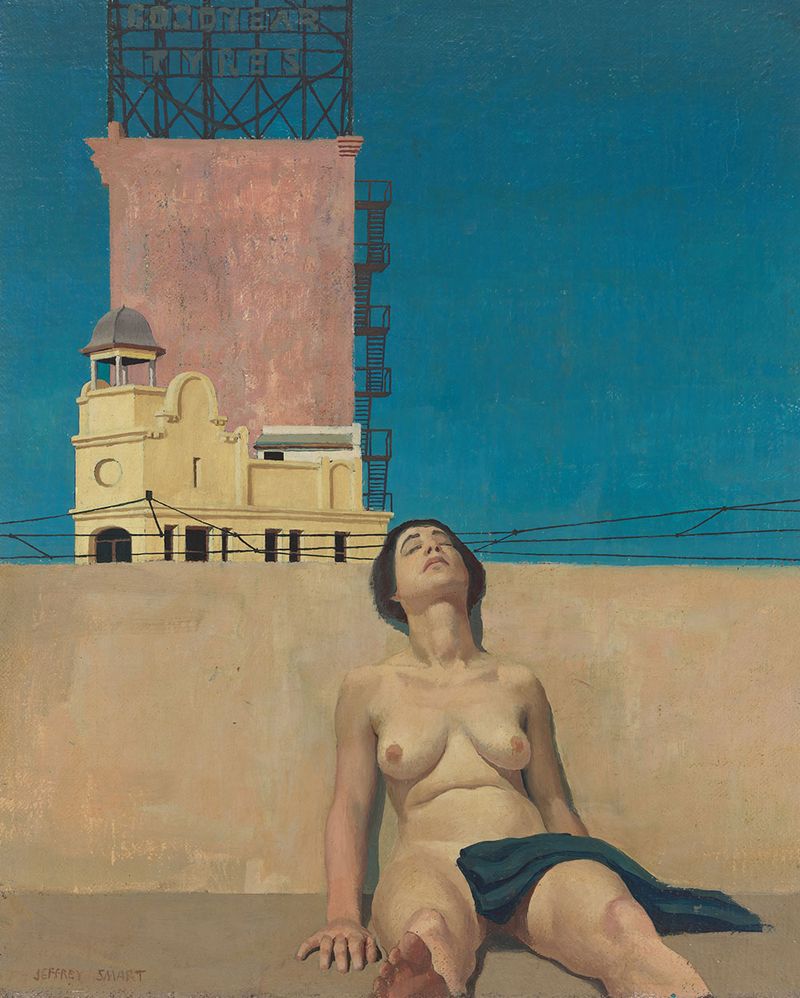 A nude woman lies back against a wall with her eyes closed and a building to her right.