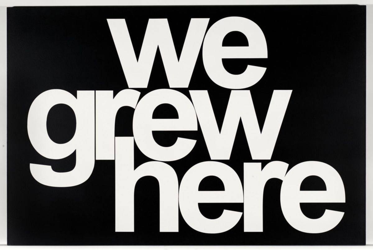A black background with white text stating "we grew here"