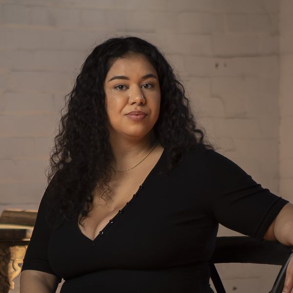Portrait of a female sitting in a chair