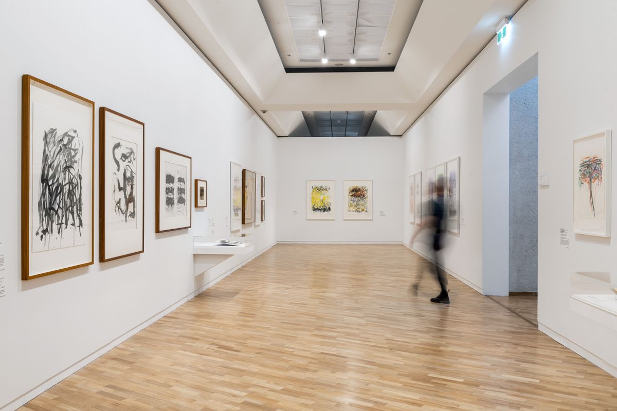 Motion view of person walking through an Art Gallery Exhibition