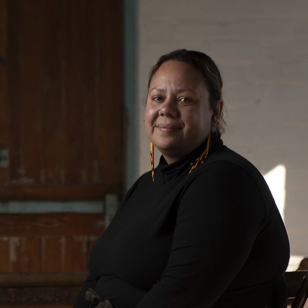 Portrait of a female sitting in a chair