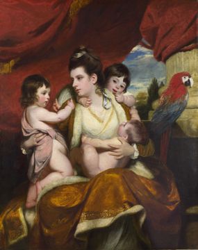 A painting of a seated woman holding an infant in her lap as two children climb around her shoulders, they are accompanied by a tropical parrot.