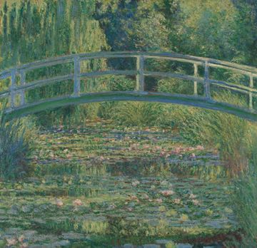 An oil painting of a bridge over a pond covered in water lilies.